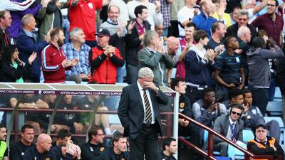 Steve Bruce, manager of Hull City, reacts after the second Aston Villa goal scored by Andreas Weimann during Villa's 2-1 win in the Premier League on Sunday. Clive Mason / Getty Images