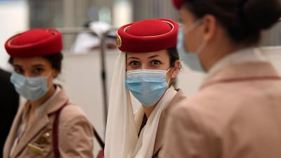 Crew members of an Emirates flight from London arrive at Dubai International Airport. AFP