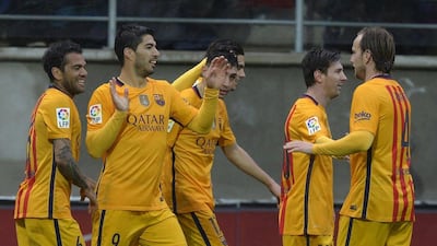 Barcelona players celebrate after a goal by Luis Suarez. Vincent West / Reuters