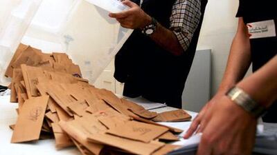 High hopes: Lebanese election officials empty a ballot box after the close of a polling station at the end of the day on June 7.