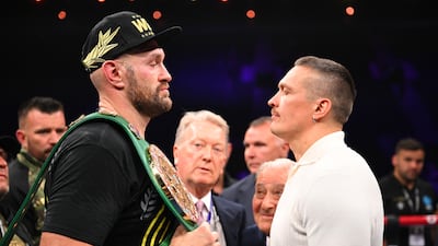 Tyson Fury, left, and Oleksandr Usyk face off after the heavyweight fight between Tyson Fury and Francis Ngannou at Boulevard Hall on October 28, 2023 in Riyadh. Getty Images
