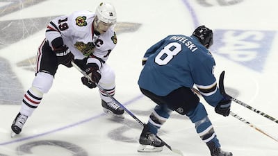 Chicago Blackhawks centre Jonathan Toews (19) against San Jose Sharks center Joe Pavelski (8) on November 23, 2016. Jeff Chiu / AP
