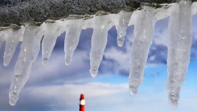 Icicles photographed in the Baltic Sea harbour of Warnemuende, near Rostock, eastern Germany. Bernd Wuestneck / dpa via AP