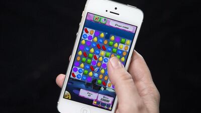 A reader says games like Candy Crush Saga cause players to withdraw from society. Carlo Allegri / Reuters