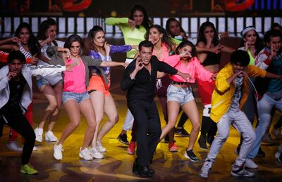 Bollywood actor Salman Khan, center, performs during the 20th International Indian Film Academy (IIFA) awards ceremony in Mumbai, India, Thursday, Sept. 19, 2019.(AP Photo/Rafiq Maqbool)