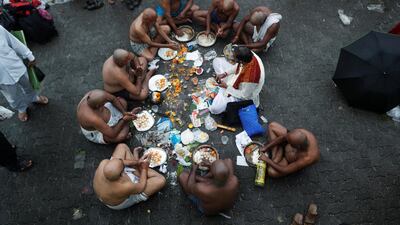 Devotees perform rituals to honour the souls of their departed ancestors on the auspicious day of Mahalaya, amid the spread of the coronavirus disease (COVID-19) in Mumbai, India, Reuters