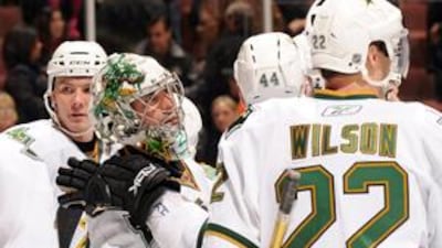 Marty Turco, the goaltender for the Dallas Stars, is congratulated by his teammates after a 3-2 win over the Anaheim Ducks. Turco made 36 saves to help his team to victory.