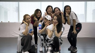 Evelyn Lau, centre back, with classmates and instructors Soojin Lee, third left, and Geum-soon Lee, front. Karma Gurung / The National