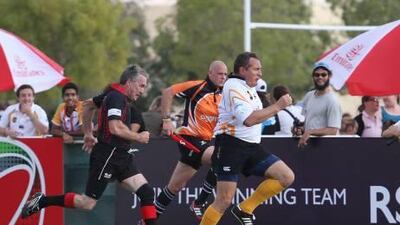 Andy Hall, right, helped Abu Dhabi Hurricanes to victory over Sharjah Fat Old Boys at The Sevens yesterday.