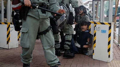 Riot police officers detain an anti-government protester in Tsuen Wan, near the site where police shot a protester with live ammunition on China's National Day in Hong Kong, China October 13, 2019. Reuters