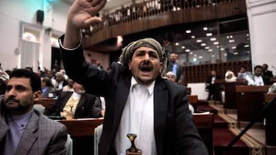 A member of the Yemeni parliament debates a law granting immunity to Yemeni President Ali Abdullah Saleh and his close aides at the parliament in Sanaa on Saturday. The Legislature passed the law.