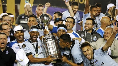 Gremio celebrate with the Libertadores Cup after beating Lanus in the final on Wednesday. David Fernandez / EPA