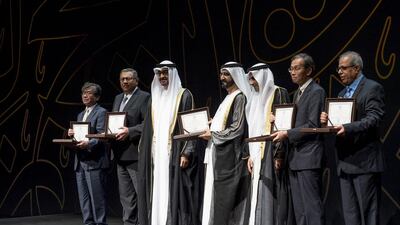 Sheikh Mohammed bin Zayed stands for a group photo with the 2015 Sheikh Zayed Book Award winners. Rashed Al Mansoori / Crown Prince Court - Abu Dhabi