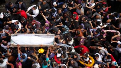 Egyptian Activists and April 6 movement members carry the coffin of Gaber Salah, an activist who died overnight after he was critically injured in clashes near Cairo's Tahrir Square last week, during his funeral at Tahrir square on November 26, 2012 in Cairo. Gianluigi Guernia / AFP