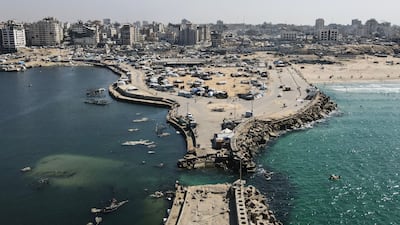 An aerial view shows tents sheltering displaced Palestinians in the war-damaged area surrounding Gaza city's port. AFP