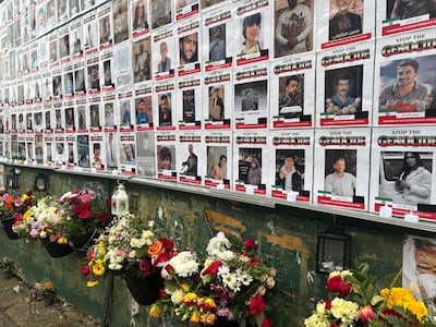 The pictures are sent to the organisers by the families, who print and laminate them before hanging them on the wall. Lemma Shehadi / The National