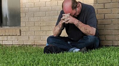 A man prays outside of the Medical Center Hospital Emergency room in Odessa following a shooting at random in the area of Odessa and Midland. Several people were dead after a gunman who hijacked a postal service vehicle in West Texas shot more than 20 people, authorities said Saturday. The gunman was killed and a few law enforcement officers were among the injured. AP