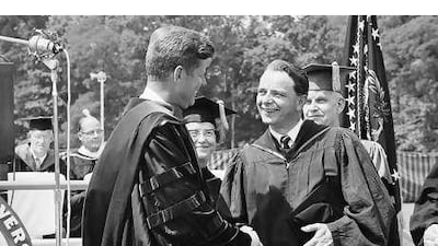 President John Kennedy shakes hands with Robert Byrd at the American University graduation ceremony in Washington in 1963.
