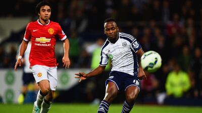 Saido Berahino of West Bromwich Albion scores their second goal to make it 2-1 as Rafael of Manchester United looks on during their Premier League match at The Hawthorns on Monday night. Laurence Griffiths / Getty Images