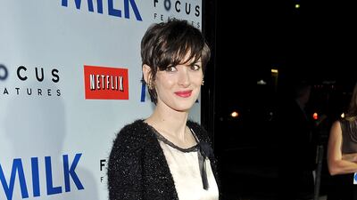 Winona Ryder in a cream dress with black edging arrives at the Los Angeles premiere of Focus Features' 'Milk', held at the Academy of Motion Picture Arts and Sciences on November 13, 2008 in Beverly Hills, California. Getty