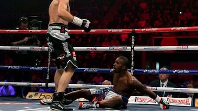 Carl Froch knocks down Yusaf Mack during their IBF super middleweight title fight