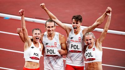 Poland's relay team celebrate awinning the 4x400m mixed relay.
