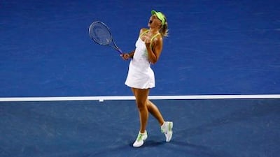 Maria Sharapova celebrates winning a game during her singles match against Sabine Lisicki.