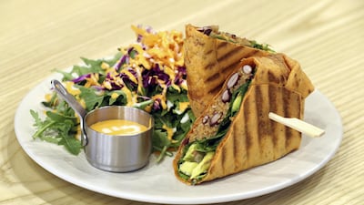 The Vegan Mojo wrap consists of spinach, avocado, tomatoes, black beans, quinoa, coriander and lime. Chris Whiteoak / The National