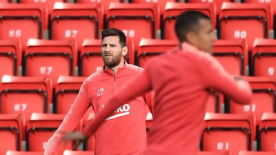 Barcelona captain Lionel Messi, left, takes part in training at Anfield ahead of the Uefa Champions League semi-final, second leg against Liverpool. AFP