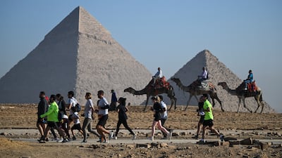 Described by National Geographic as one of the world’s most amazing running routes, the seventh Pyramids Half Marathon took place at the Pyramids of Giza on Saturday December 13. All photos: EPA