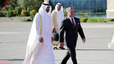 Sheikh Mohamed bin Zayed, Crown Prince of Abu Dhabi and Deputy Supreme Commander of the UAE Armed Forces, is welcomed by Jordan's King Abdullah II at Queen Alia Airport in Amman, Jordan, on Tuesday. Andre Pain / EPA