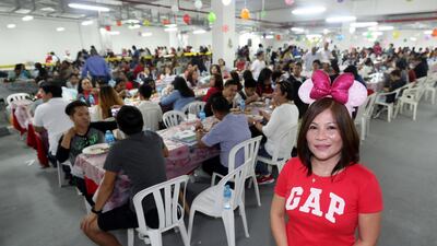 Elna Timtim, a church volunteer, said she hoped the holiday food and music would help ease some of the pain felt by those experiencing troubled times. Chris Whiteoak / The National