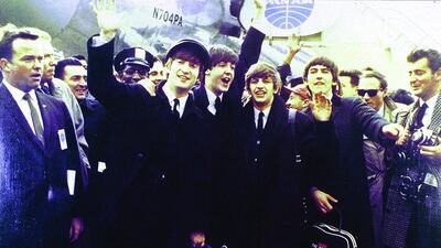 The Beatles arrive at JFK Airport in New York City for their first US tour. GAB Archive / Redferns / Getty Images
