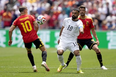 Leandro Trossard, left, in action with Egypt's Mohamed Salah. EPA