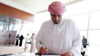 Khalfan Al Neaimi, a third-year business and economy student, applies for one of the 60 positions on offer at the Emirates Transport job fair at the InterContinental Hotel in Dubai yesterday. Sarah Dea / The National