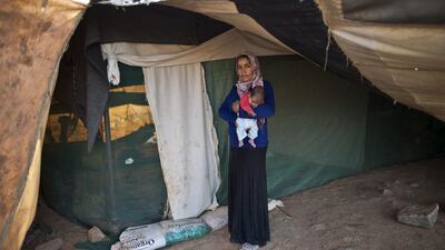 Khalida Moussa, 28, holds her son Abdulelah, 5 weeks old.