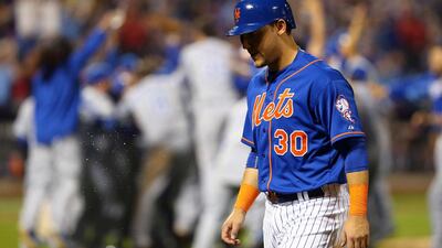Michael Conforto #30 of the New York Mets reacts after the Kansas City Royals defeat the New York Mets to win Game Five of the 2015 World Series at Citi Field on November 1, 2015 in the Flushing neighborhood of the Queens borough of New York City. The Kansas City Royals defeated the New York Mets with a score of 7 to 2 to win the World Series. Elsa/Getty Images/AFP