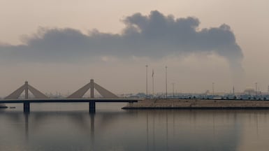 Smoke rises after a reported Iranian strike on fuel tanks in Muharraq, Bahrain, on Thursday. AFP