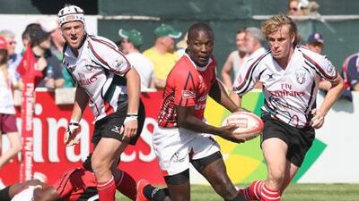 UAE, in white, were outplayed at the Dubai Rugby Sevens this year, and coach Wayne Marsters has called for a clearer selection policy.