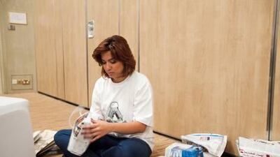 In this year's Bag the Waste event, volunteers create bags out of newspapers - an eco-friendly alternative to plastic carrier bags. Lee Hoagland / The National