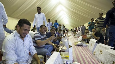 Muslims break their fasts at Sheikh Zayed Grand Mosque on the first day of Ramadan. Leslie Pableo for The National