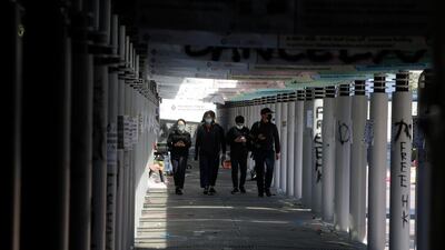 Protesters walk inside the campus. AP Photo
