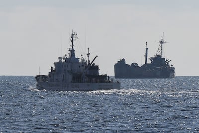 A Philippine coast guard vessel patrols near the grounded navy ship BRP Sierra Madre at Second Thomas Shoal in the Spratly Islands. AFP