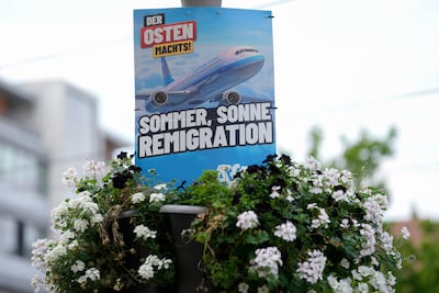 An AfD election poster promises 'summer, sun, remigration'. AP