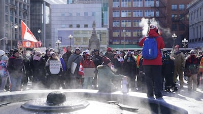 Benita Pedersen addresses the crowd outside of the Canadian Parliament building during an anti-vaccine protest. Willy Lowry / The National