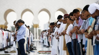 Worshippers perform Eid Al Fitr prayers at Sheikh Zayed Grand Mosque in Abu Dhabi. Christopher Pike / The National
