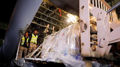 Personnel unload an aircraft carrying the first batch of the Sinopharm vaccine at Baghdad International Airport, Baghdad. China donated this first shipment of 50,000 shots. Reuters