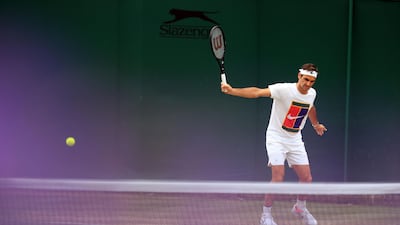 Roger Federer during a training session on Day 12 of the Wimbledon Championships at The All England Lawn Tennis and Croquet Club, Wimbledon.
