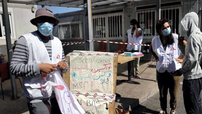 Homeless people wait to be vaccinated against coronavirus by Medecins Sans Frontieres personnel at a MSF medical centre in Paris, France. AFP