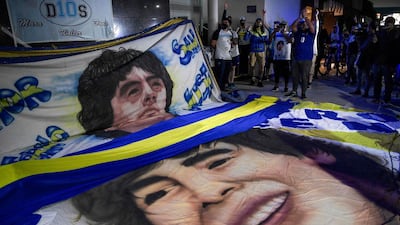 Supporters of Diego Maradona gather outside the hospital where he undergoes a brain surgery for a blood clot, in Olivos, Buenos Aires . AFP